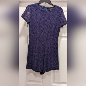 Navy Romper with zipper back. Never Worn. Size small